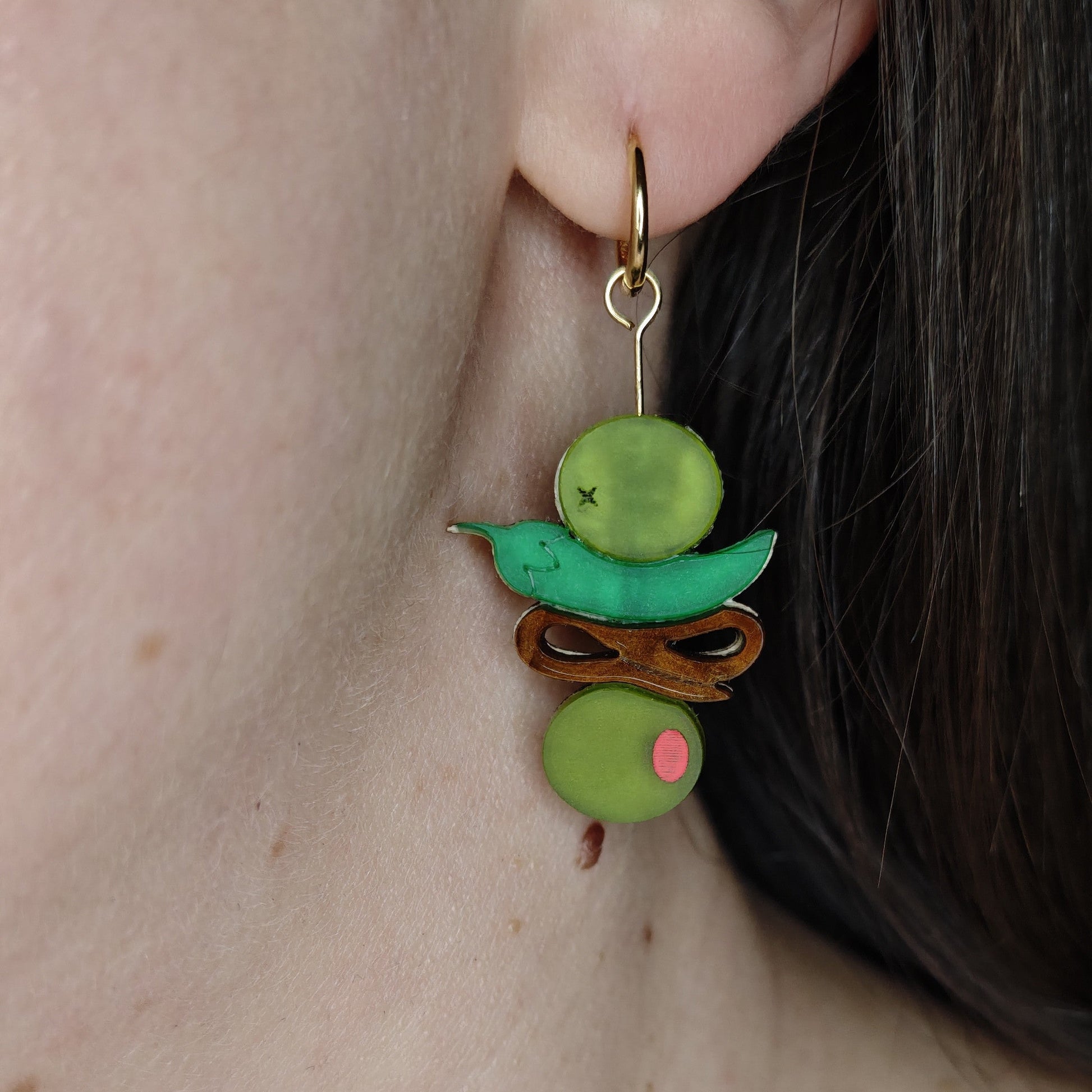 Gilda pintxo hoop charm wearing on up green and brown
