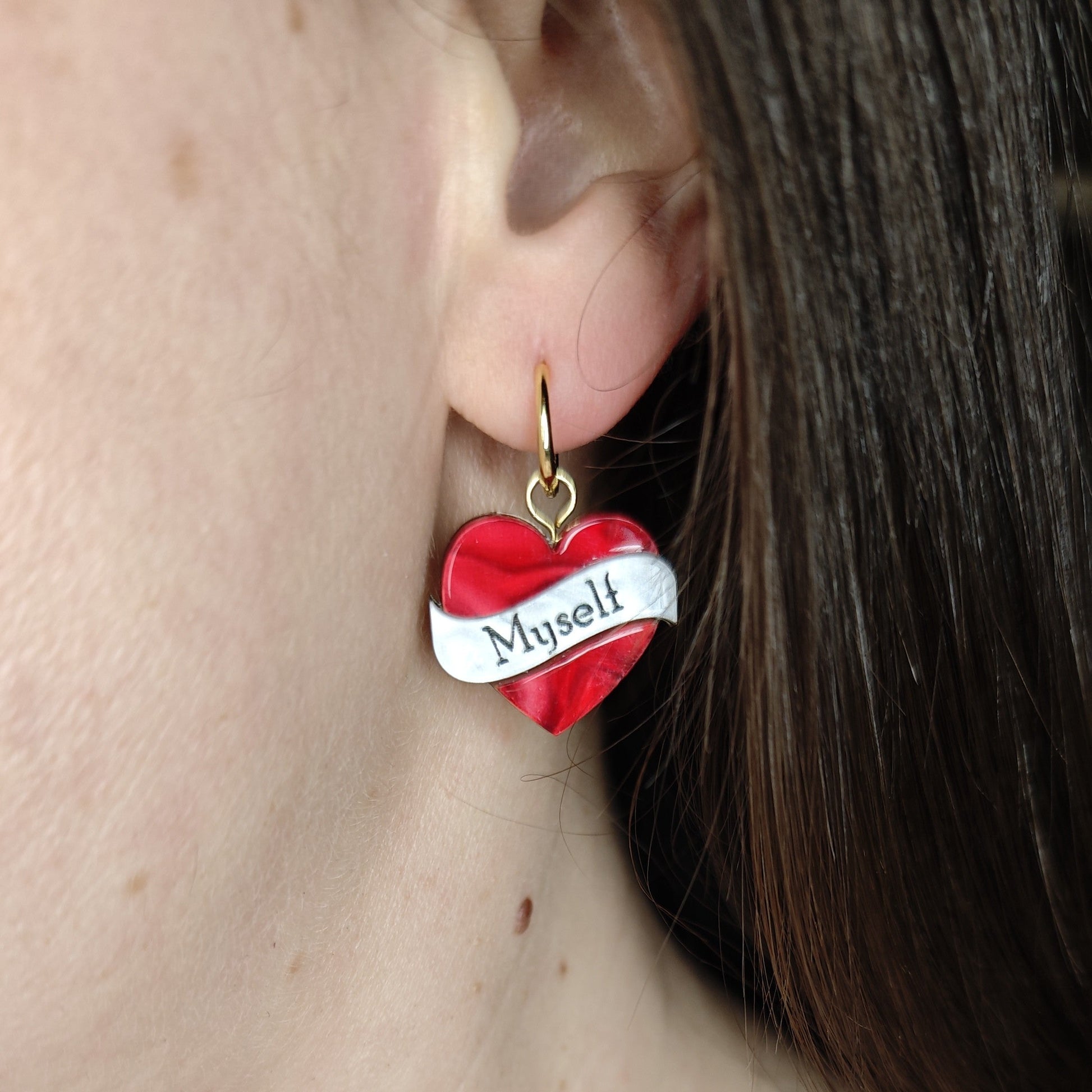 labelled heart hoop charm earring - wearing on