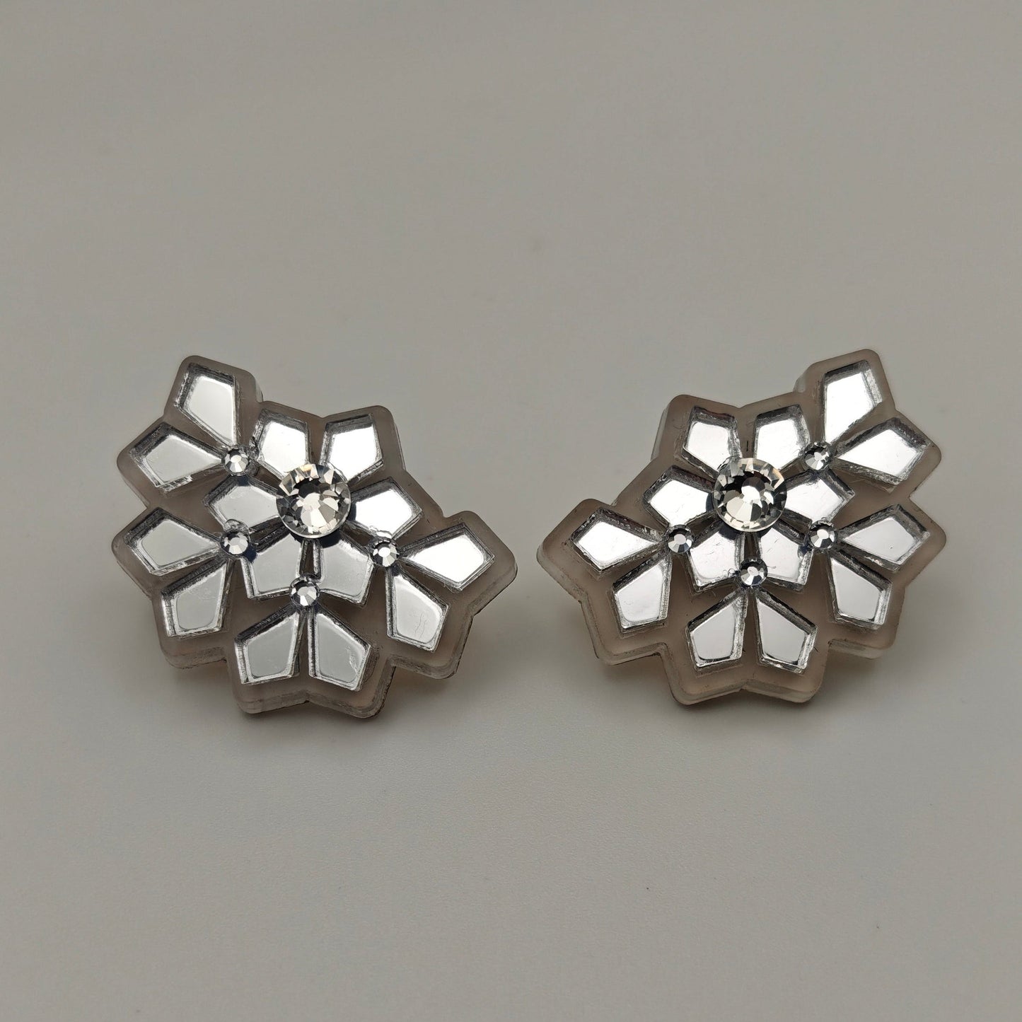 Silver acrylic stud earrings white frosted snowflake, close up picture