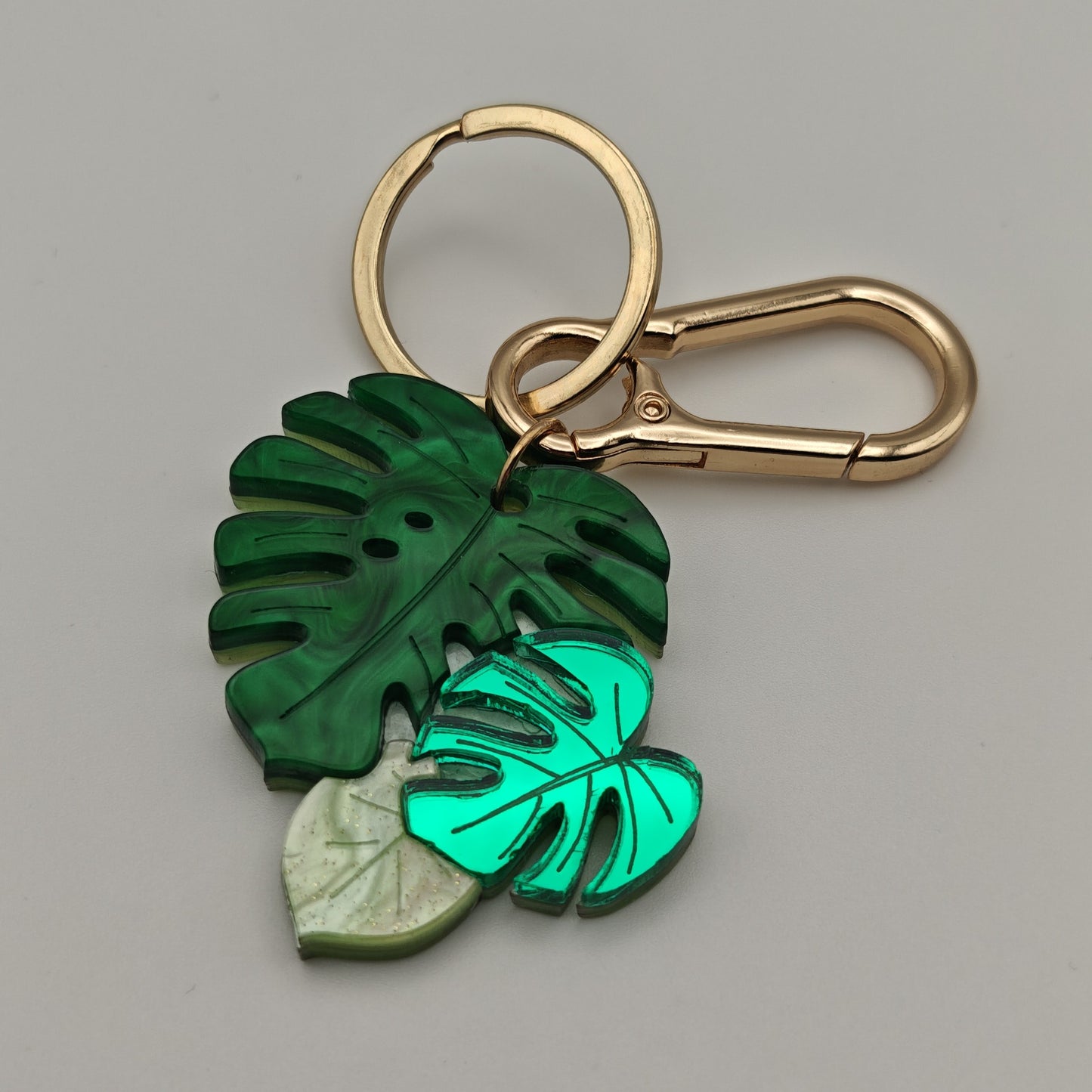 Green multi tone marbled mirror metallic glitter golden clasp keyring bag charm monstera plant leaves leaf