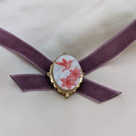 statement bold light-wear comfortable hypoallergenic stainless steel velvet ribbon Victorian brooch hummingbird marbled white pink inked metallic gold violet close