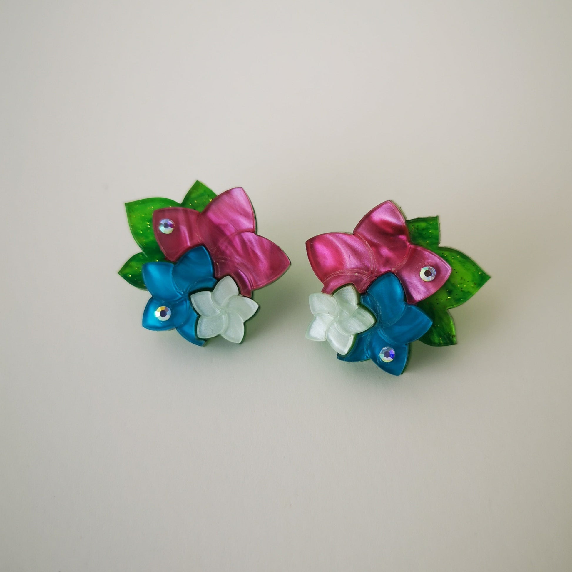 statement bold light-wear comfortable hypoallergenic stainless post lobe earrings flowers blue light green pink rhinestones glitter close